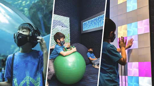 Kids playing in touch reactive games in a sensory room.